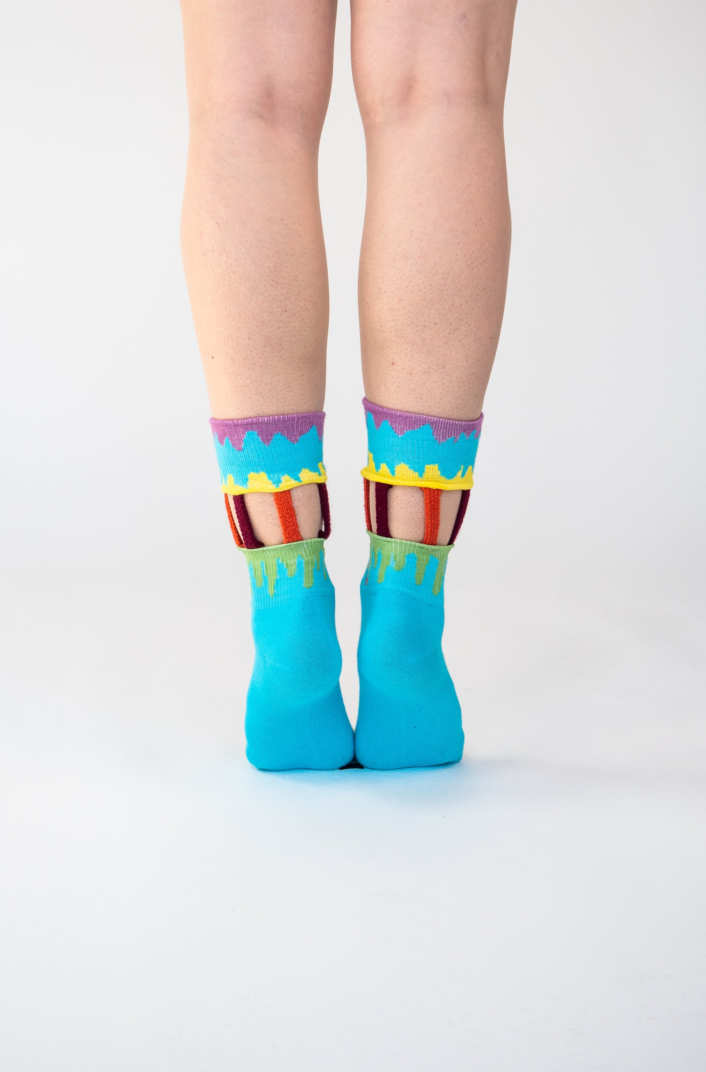 Atypical Attire socks are unique socks and luxury socks. These Ice Cream Carousel socks are unisex multicoloured cotton socks which are blue with a yellow, pink and green drip pattern and handmade strips of orange and maroon for a fun quirky style.