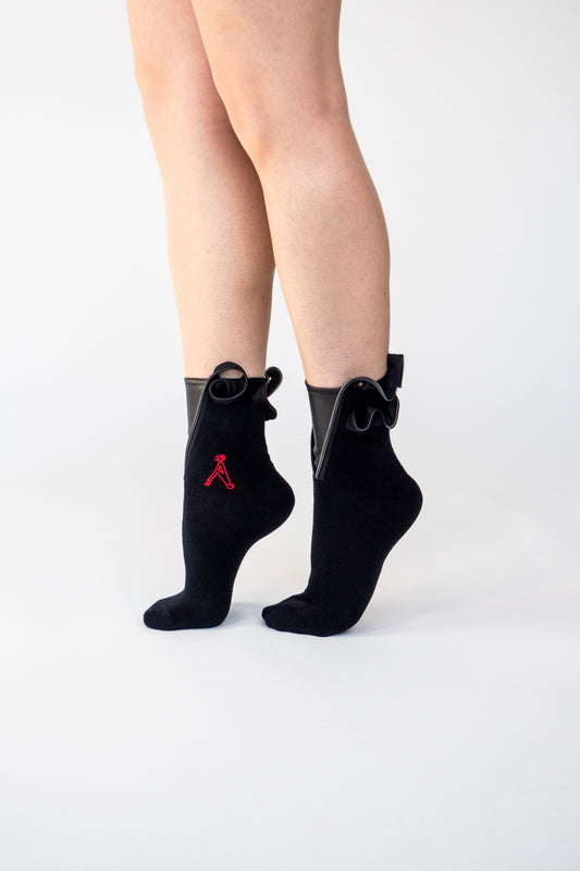 atypical attire socks are unique socks and luxury socks and these black swirl socks are made from cotton and use zips and vegan leather