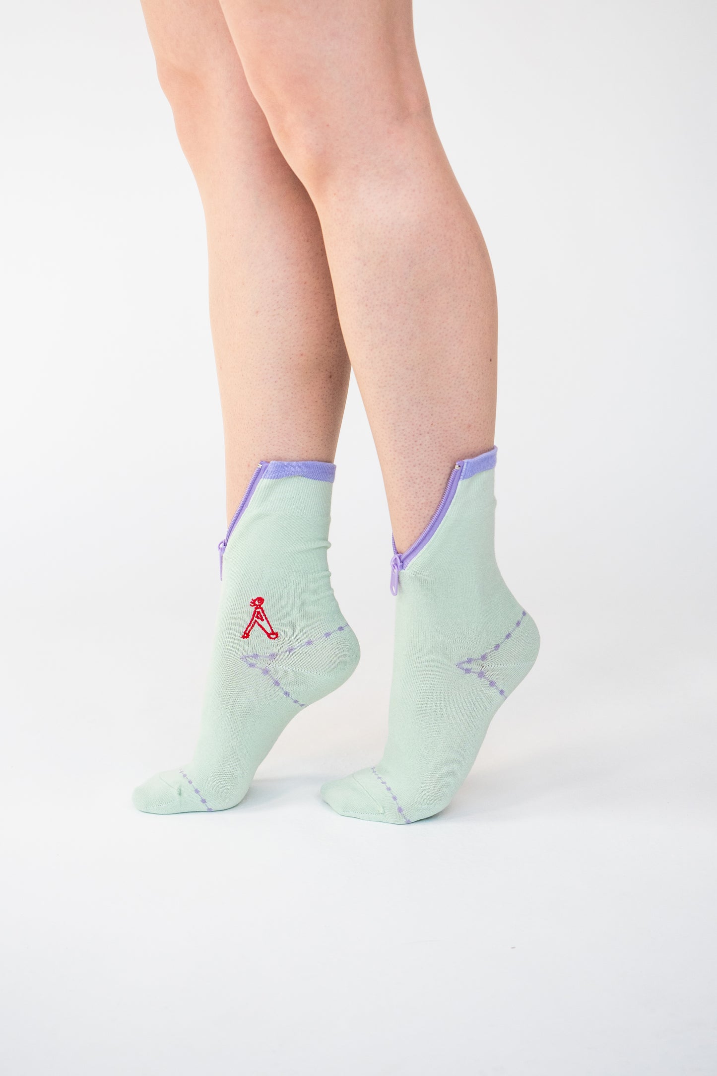 Atypical Attire socks are unique socks and luxury socks. These Lime Purple socks are unisex green cotton socks with a purple zip for a fun quirky style. 