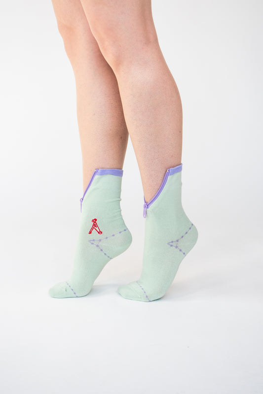 Atypical Attire socks are unique socks and luxury socks. These Lime Purple socks are unisex green cotton socks with a purple zip for a fun quirky style.