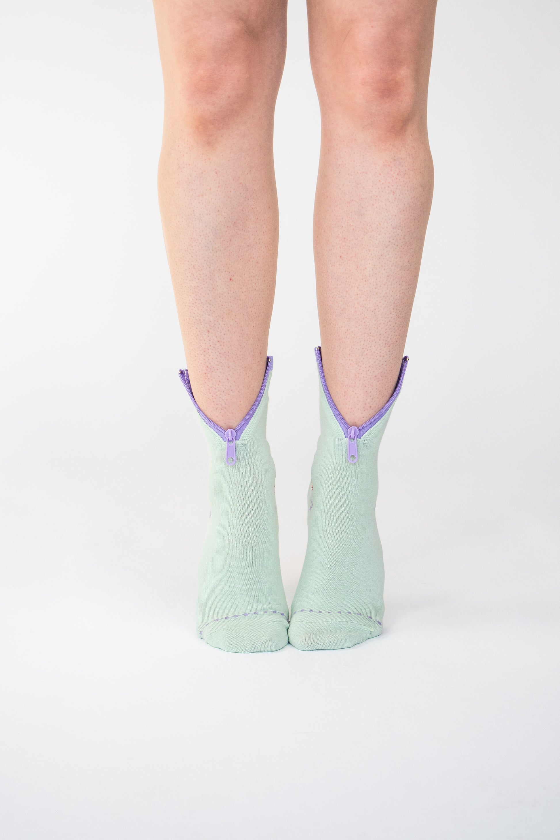 Atypical Attire socks are unique socks and luxury socks. These Lime Purple socks are unisex green cotton socks with a purple zip for a fun quirky style. 