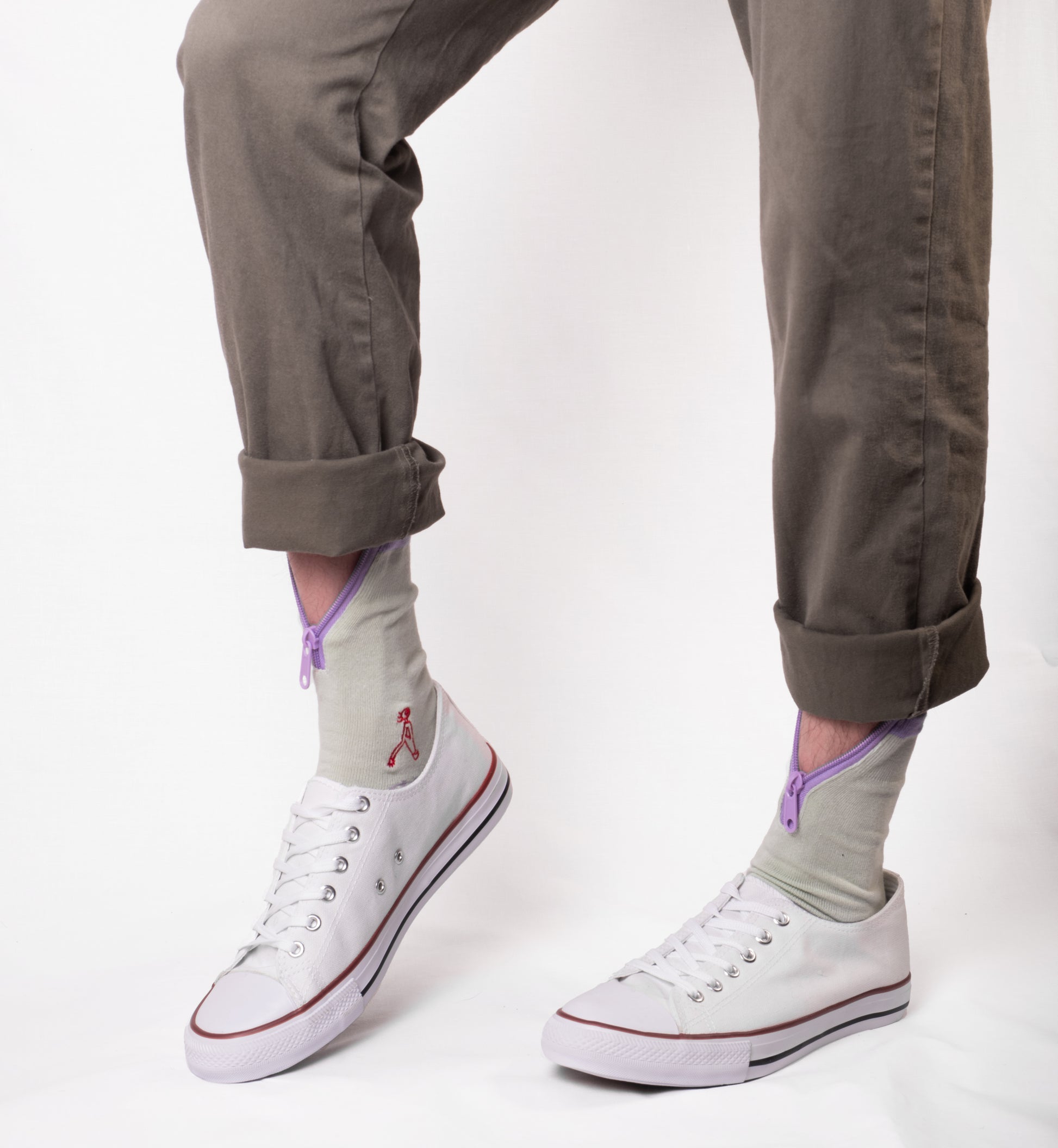 Atypical Attire socks are unique socks and luxury socks. These Lime Purple socks are unisex green cotton socks with a purple zip for a fun quirky style. They are worn zipped down with converses and chinos